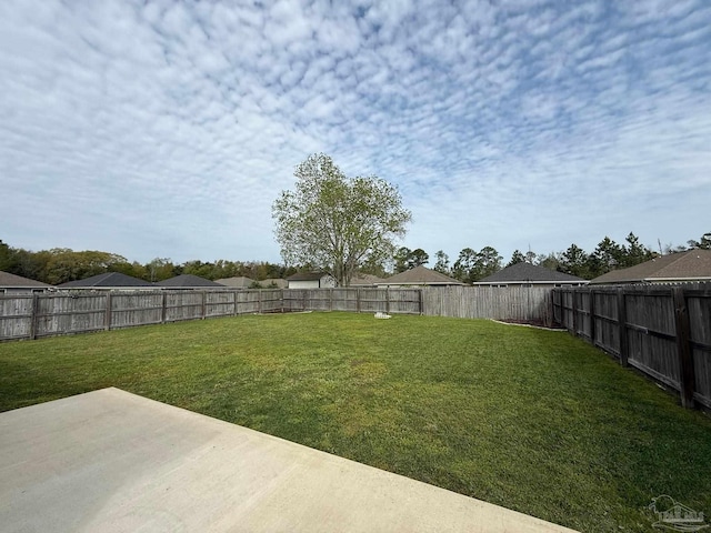 view of yard featuring a fenced backyard and a patio area