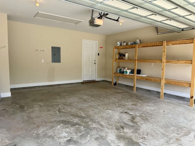 garage with a garage door opener and electric panel