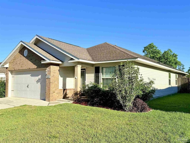 view of front of property featuring a front yard, brick siding, concrete driveway, an attached garage, and a shingled roof