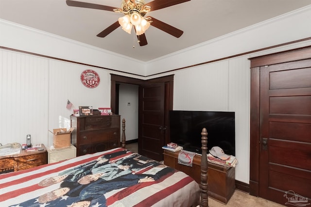 bedroom featuring light carpet, crown molding, and a ceiling fan
