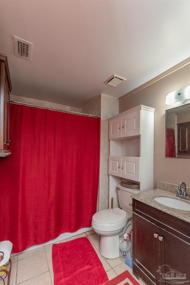 bathroom with toilet, vanity, tile patterned floors, and a shower with curtain