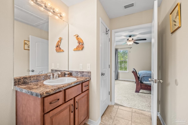 bathroom featuring ceiling fan, vanity, and tile patterned floors