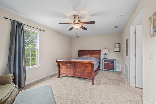 bedroom featuring light carpet and ceiling fan