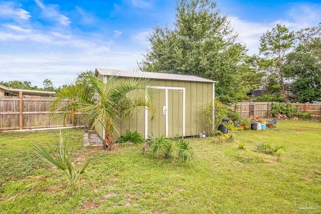 view of outbuilding featuring a lawn