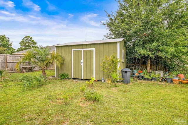 view of outbuilding with a lawn