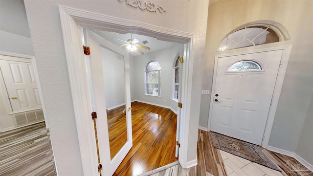 entryway featuring hardwood / wood-style flooring and ceiling fan