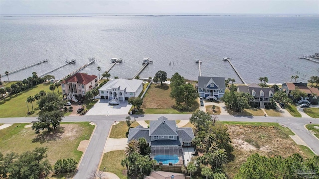 bird's eye view featuring a water view and a residential view