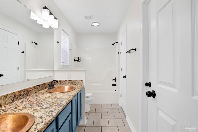 full bathroom featuring tile patterned flooring, vanity, toilet, and shower / tub combination