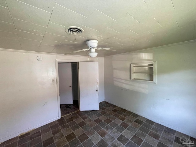 unfurnished room with tile patterned flooring and ceiling fan