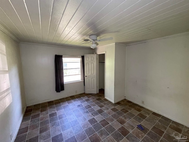 interior space featuring ornamental molding, wood ceiling, tile patterned flooring, and ceiling fan