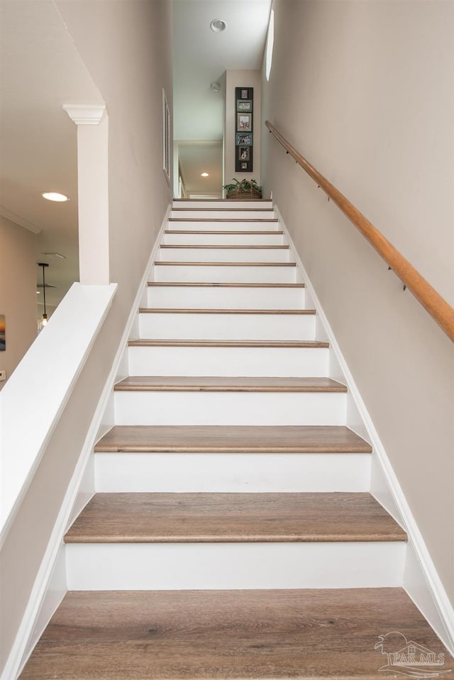staircase featuring recessed lighting