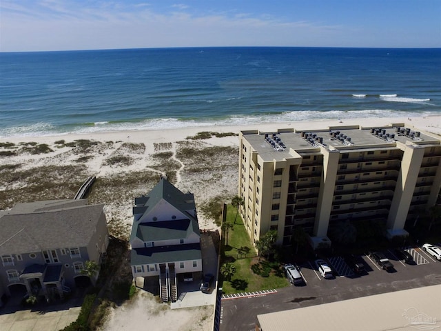 drone / aerial view featuring a view of the beach and a water view