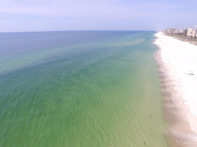 bird's eye view featuring a water view and a view of the beach
