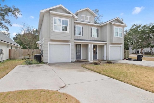 view of front facade featuring a garage and a front yard