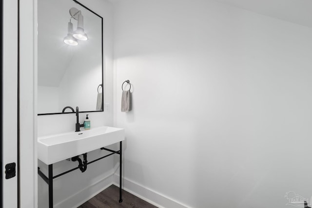 bathroom with hardwood / wood-style flooring