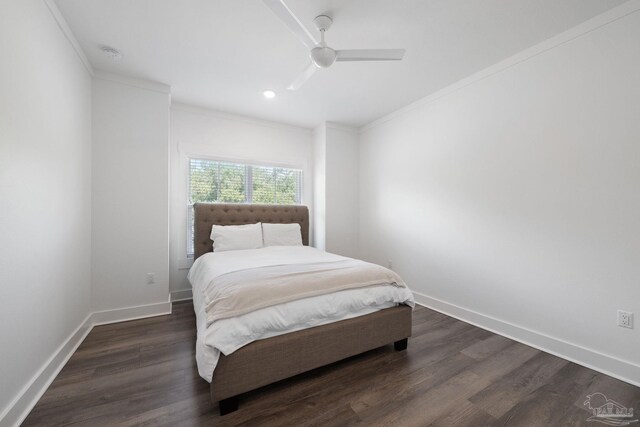 bedroom with ceiling fan, ornamental molding, and dark hardwood / wood-style floors