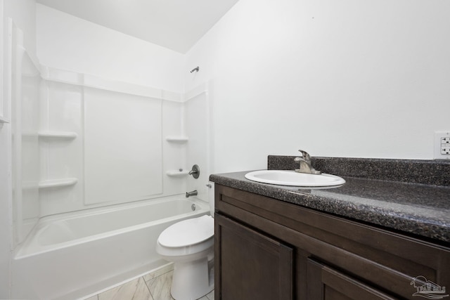 bathroom with marble finish floor,  shower combination, vanity, and toilet