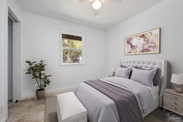 bedroom featuring a ceiling fan and baseboards