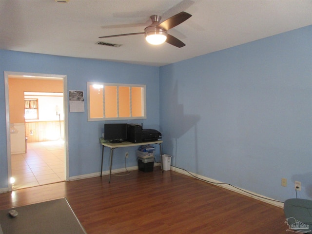 office space with wood-type flooring and ceiling fan