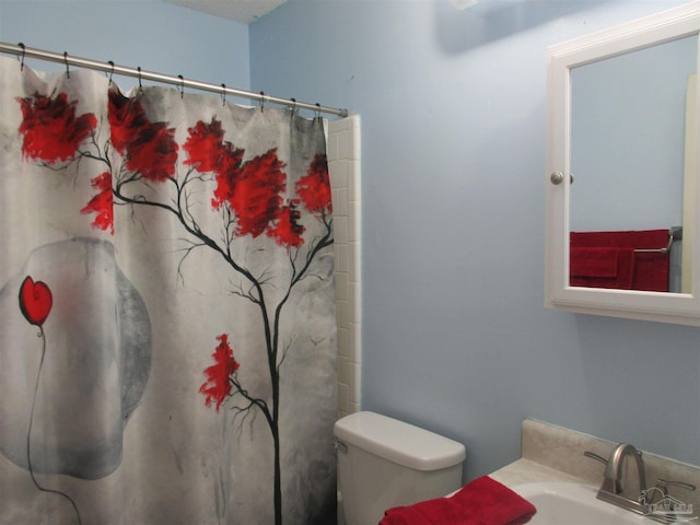 full bathroom featuring vanity and toilet