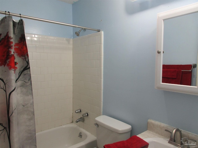 full bathroom with shower / tub combo, a sink, and toilet