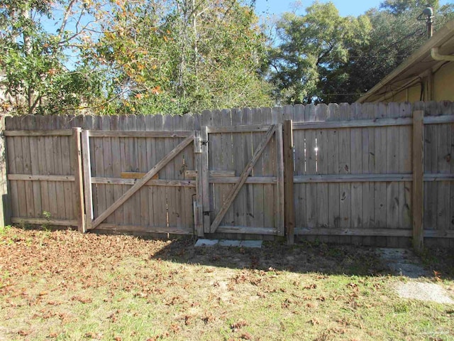 view of gate with fence