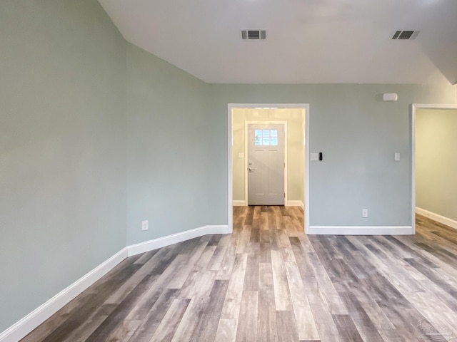 unfurnished room with light hardwood / wood-style flooring