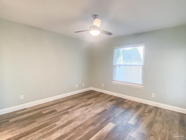 spare room featuring ceiling fan and dark hardwood / wood-style flooring