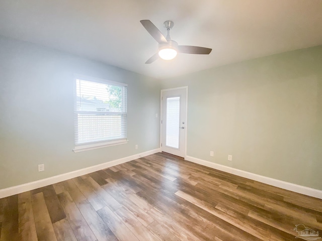 unfurnished room featuring hardwood / wood-style floors and ceiling fan