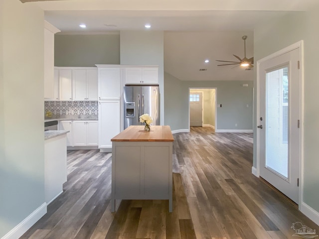 kitchen with white cabinetry, wooden counters, decorative backsplash, stainless steel fridge with ice dispenser, and dark wood-type flooring