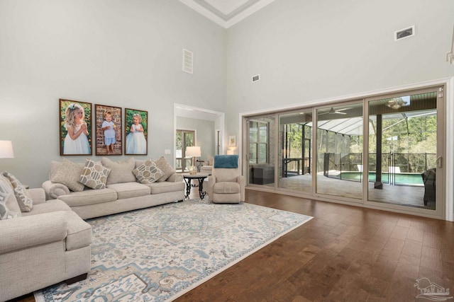 8901 Salt Grass Dr, Pensacola, FL 32526 - living area featuring ornamental molding, visible vents, and dark wood finished floors