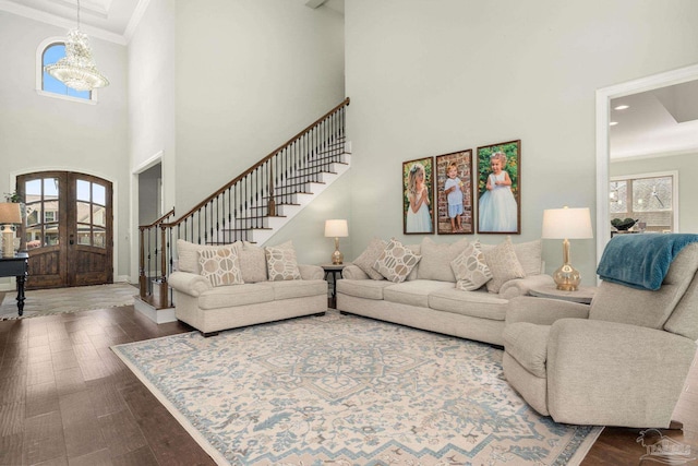 8901 Salt Grass Dr, Pensacola, FL 32526 - living room with a healthy amount of sunlight, stairs, hardwood / wood-style floors, and french doors