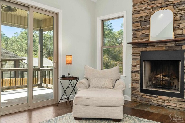 8901 Salt Grass Dr, Pensacola, FL 32526 - living area with baseboards, hardwood / wood-style floors, and a stone fireplace