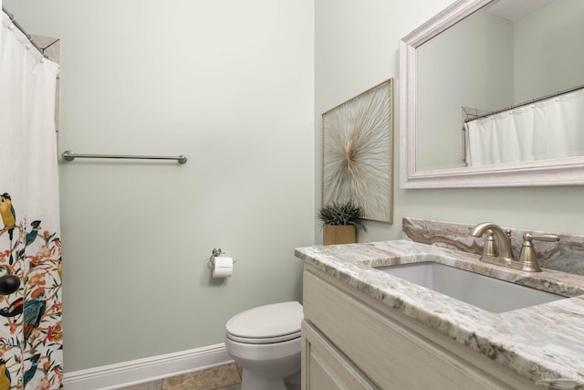 8901 Salt Grass Dr, Pensacola, FL 32526 - full bathroom with toilet, vanity, and baseboards
