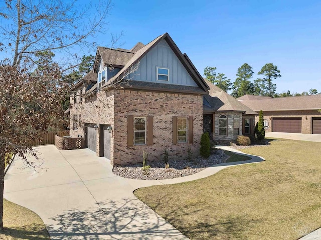 craftsman-style house with brick siding, fence, concrete driveway, a front lawn, and board and batten siding