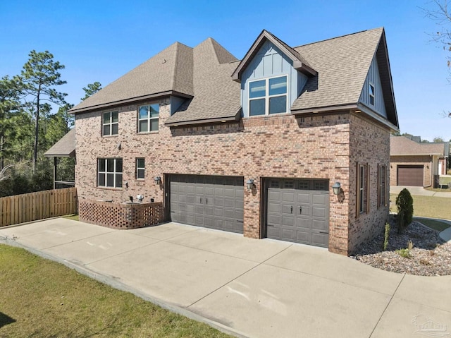 8901 Salt Grass Dr, Pensacola, FL 32526 - view of front facade with board and batten siding, brick siding, fence, and a shingled roof