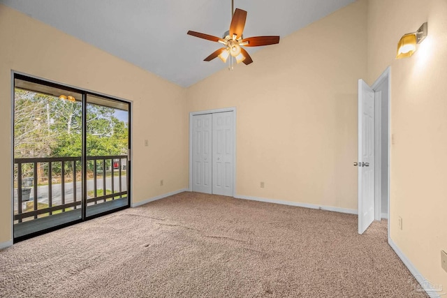 unfurnished bedroom with carpet floors, access to exterior, baseboards, and high vaulted ceiling