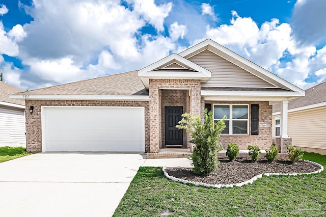 5805 Guinevere Ln, Milton, FL 32583 - view of front of house with brick siding, concrete driveway, and an attached garage