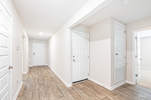 5805 Guinevere Ln, Milton, FL 32583 - hall with light wood-type flooring and baseboards