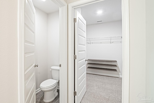 5805 Guinevere Ln, Milton, FL 32583 - bathroom with a spacious closet and toilet