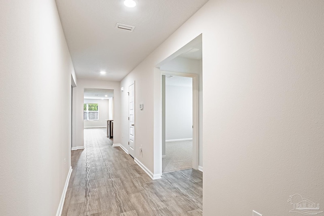 5805 Guinevere Ln, Milton, FL 32583 - hall featuring wood finished floors, recessed lighting, and baseboards