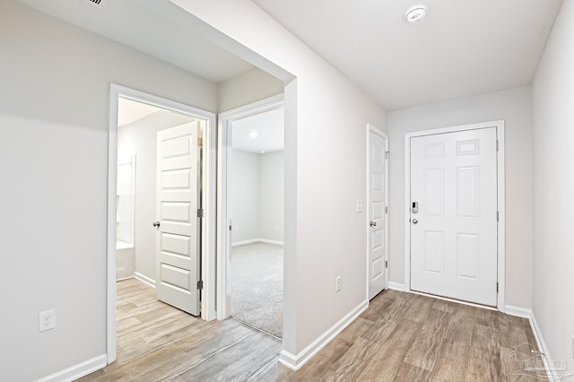 5805 Guinevere Ln, Milton, FL 32583 - foyer entrance featuring light wood-style flooring and baseboards