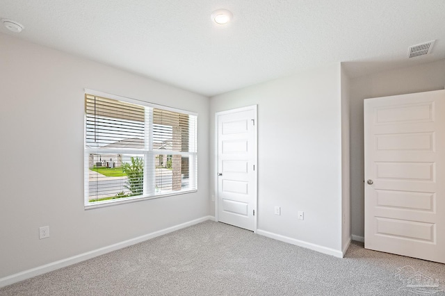 5805 Guinevere Ln, Milton, FL 32583 - unfurnished bedroom featuring light carpet and baseboards