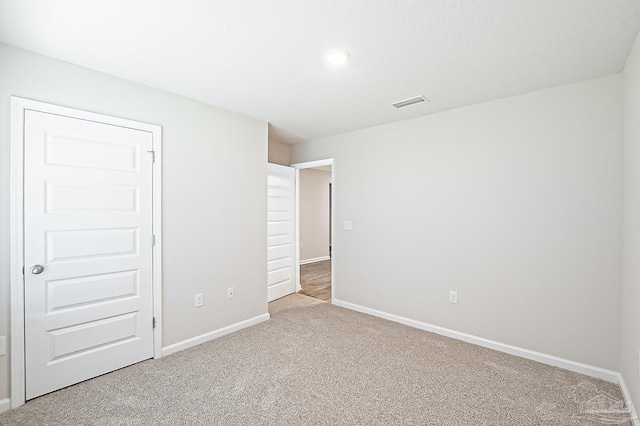 5805 Guinevere Ln, Milton, FL 32583 - unfurnished bedroom with carpet flooring, baseboards, and recessed lighting