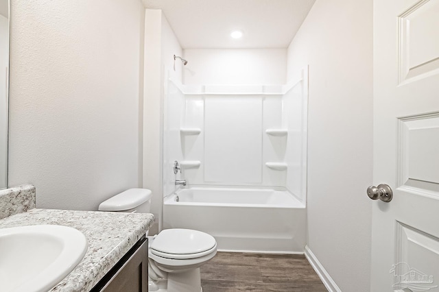 5805 Guinevere Ln, Milton, FL 32583 - full bathroom with wood finished floors, vanity, toilet, bathtub / shower combination, and baseboards