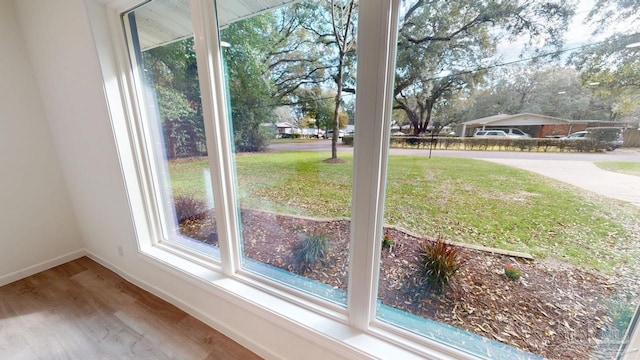 interior details with wood finished floors and baseboards