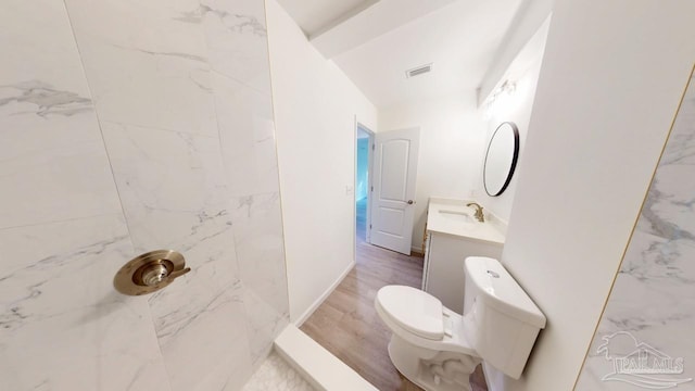 full bathroom featuring visible vents, toilet, baseboards, walk in shower, and vanity