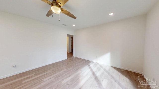 unfurnished room featuring visible vents, recessed lighting, light wood-type flooring, and baseboards