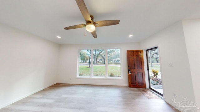 foyer entrance featuring recessed lighting, light wood-type flooring, and baseboards