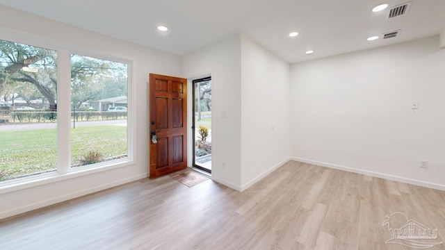 foyer with visible vents, recessed lighting, light wood-style floors, and baseboards